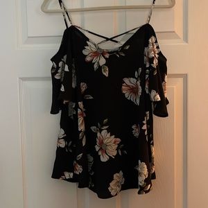 Cold shoulder floral blouse. Criss-cross straps in the back.